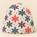 Nordic snowflake beanie on a cream studio background