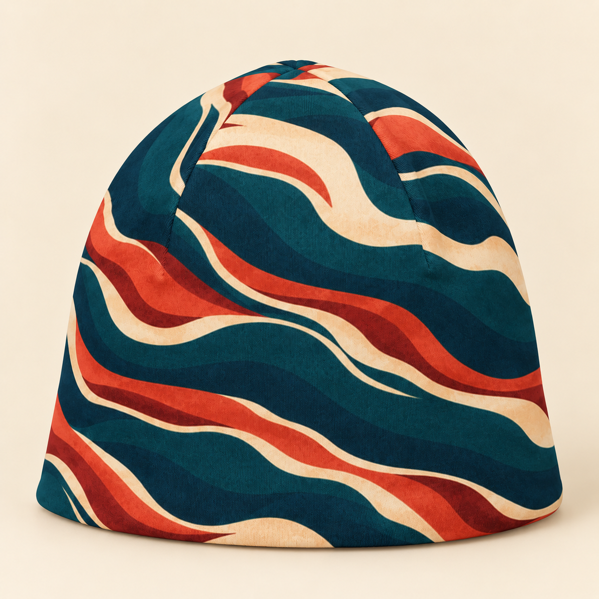 Teal rust and cream abstract beanie on a cream studio background