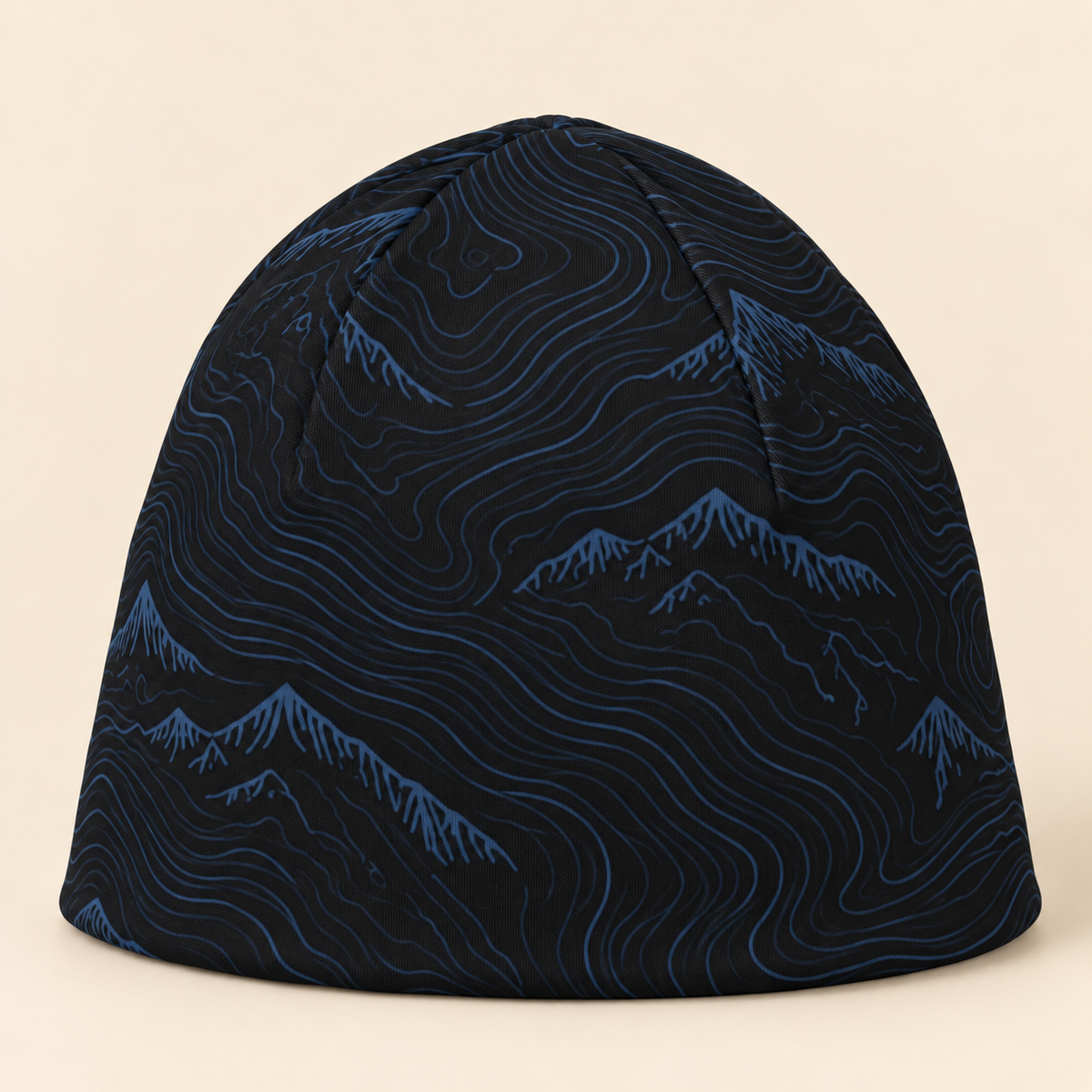 Mountain Trek black and navy beanie on a cream studio background