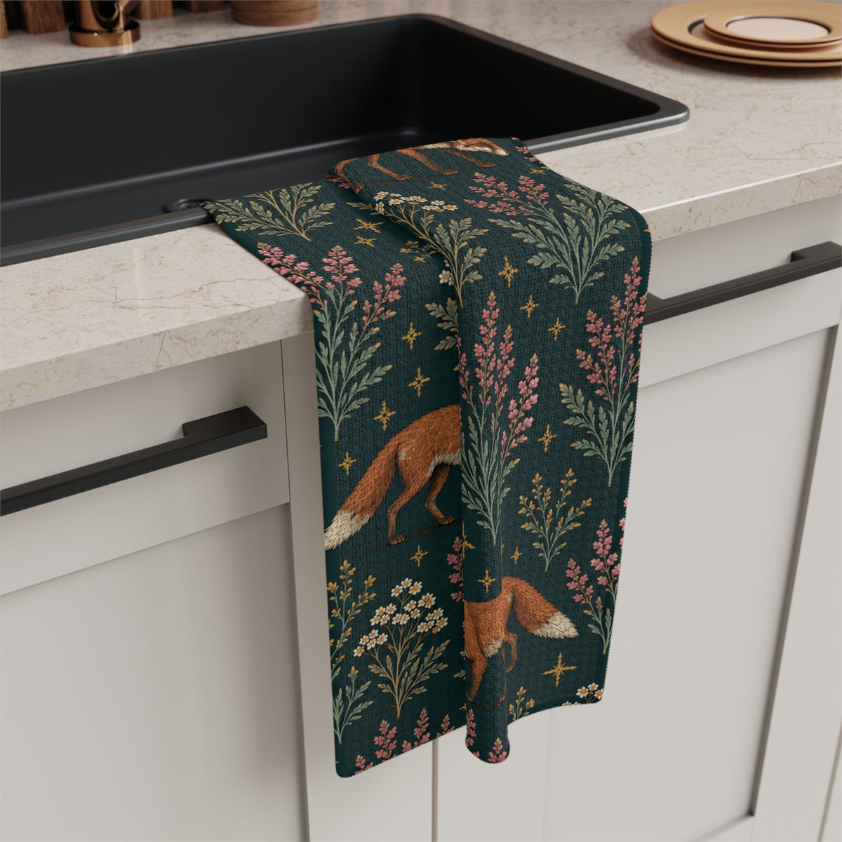 Fox and Heather kitchen towel draped beside a black sink