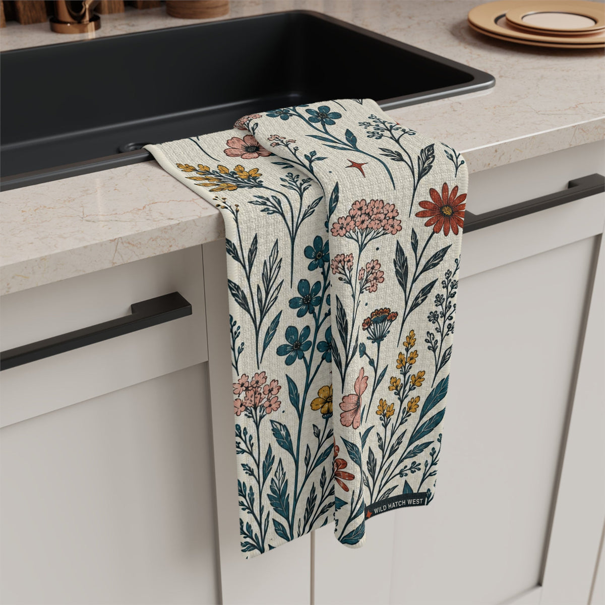 Flora and Diamond Bouquet tea towel draped over a kitchen counter beside a sink