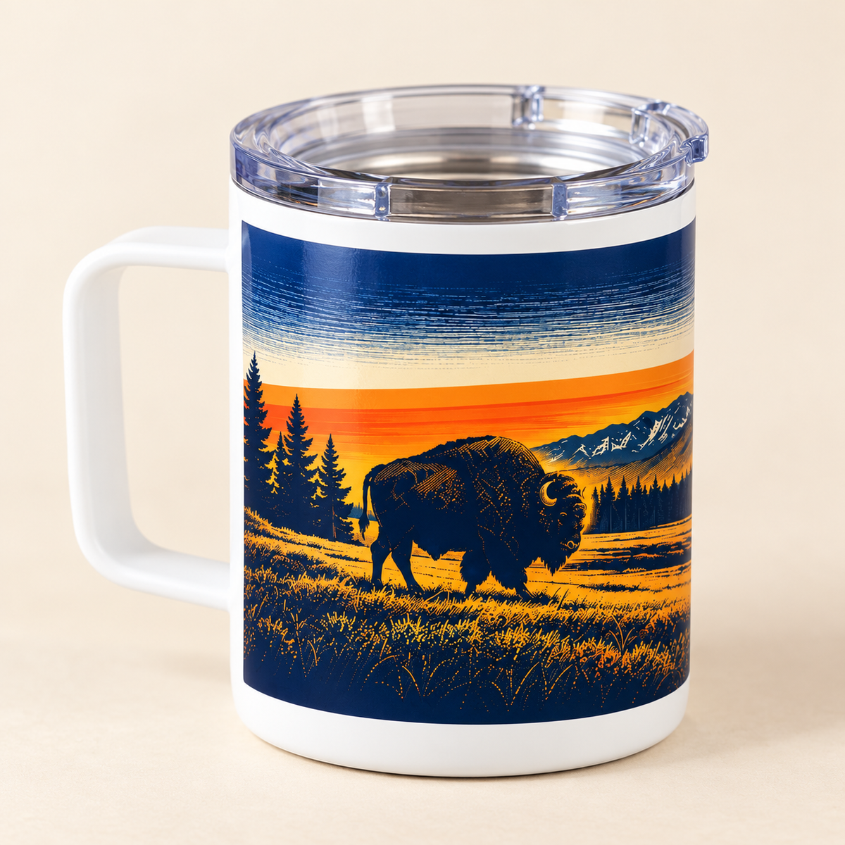 bison sunset 10 oz travel mug with clear lid on a cream studio background