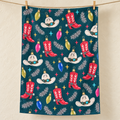Cowboy Christmas tea towel — hero, subtle waffle texture and matching overlocked edges