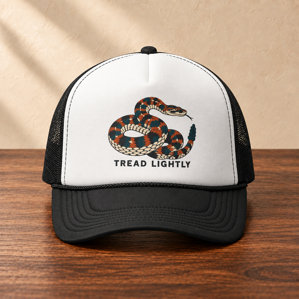 Tread Lightly Snake Trucker Hat — Retro Warning Graphic Foam Cap, front studio view on dark wood against a cream wall