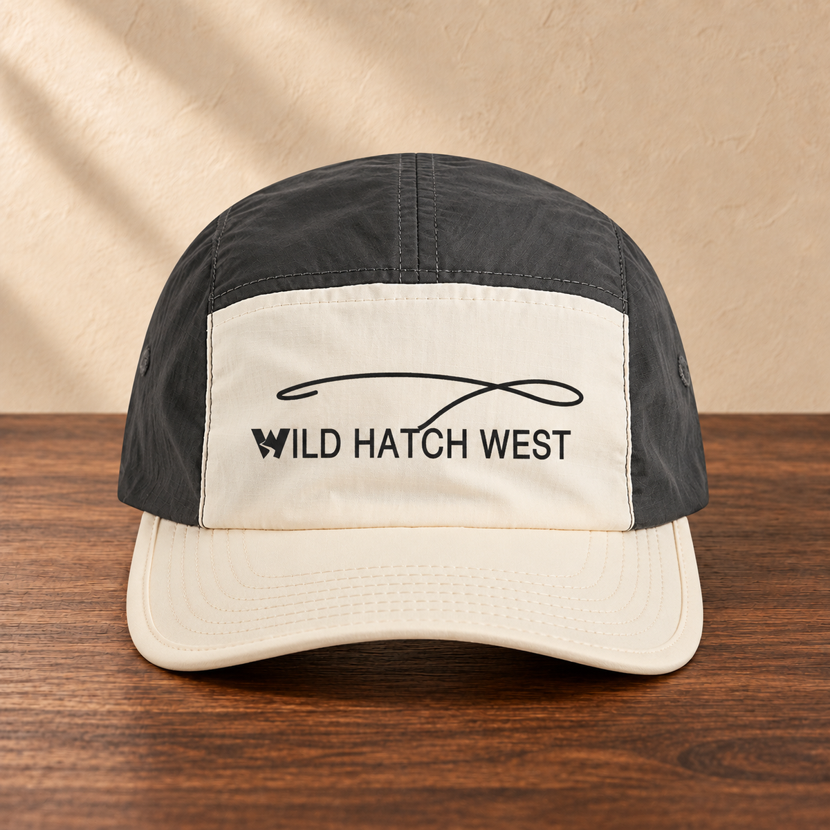 Finn Two-Tone Nylon Cap, front studio view on dark wood against a cream wall
